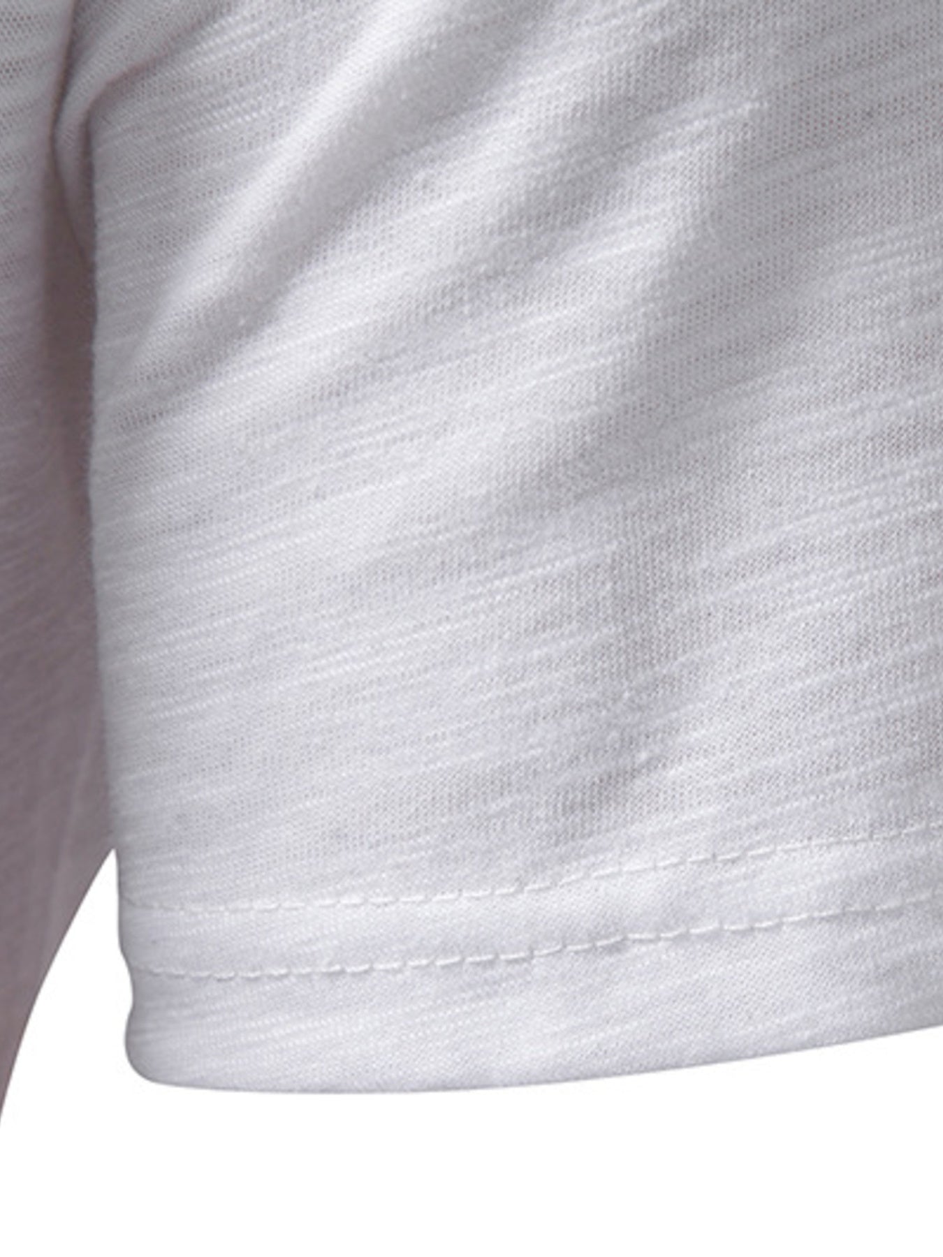 Close-up of a white shirt with buttons on a white background