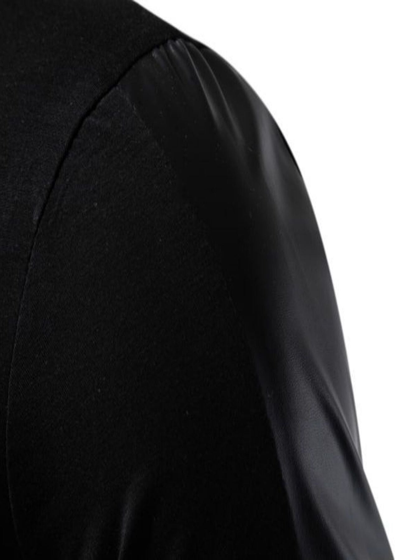 Close-up of a black garment with a white background