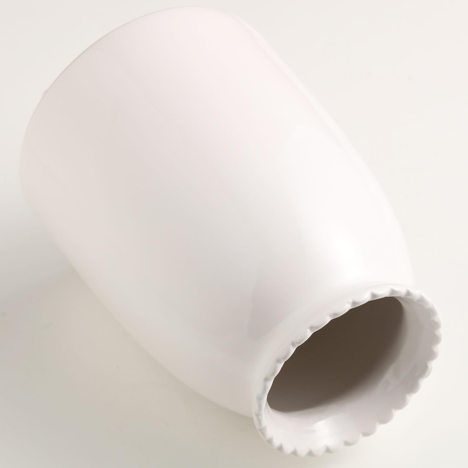Close-up of a roll of white paper on a white background
