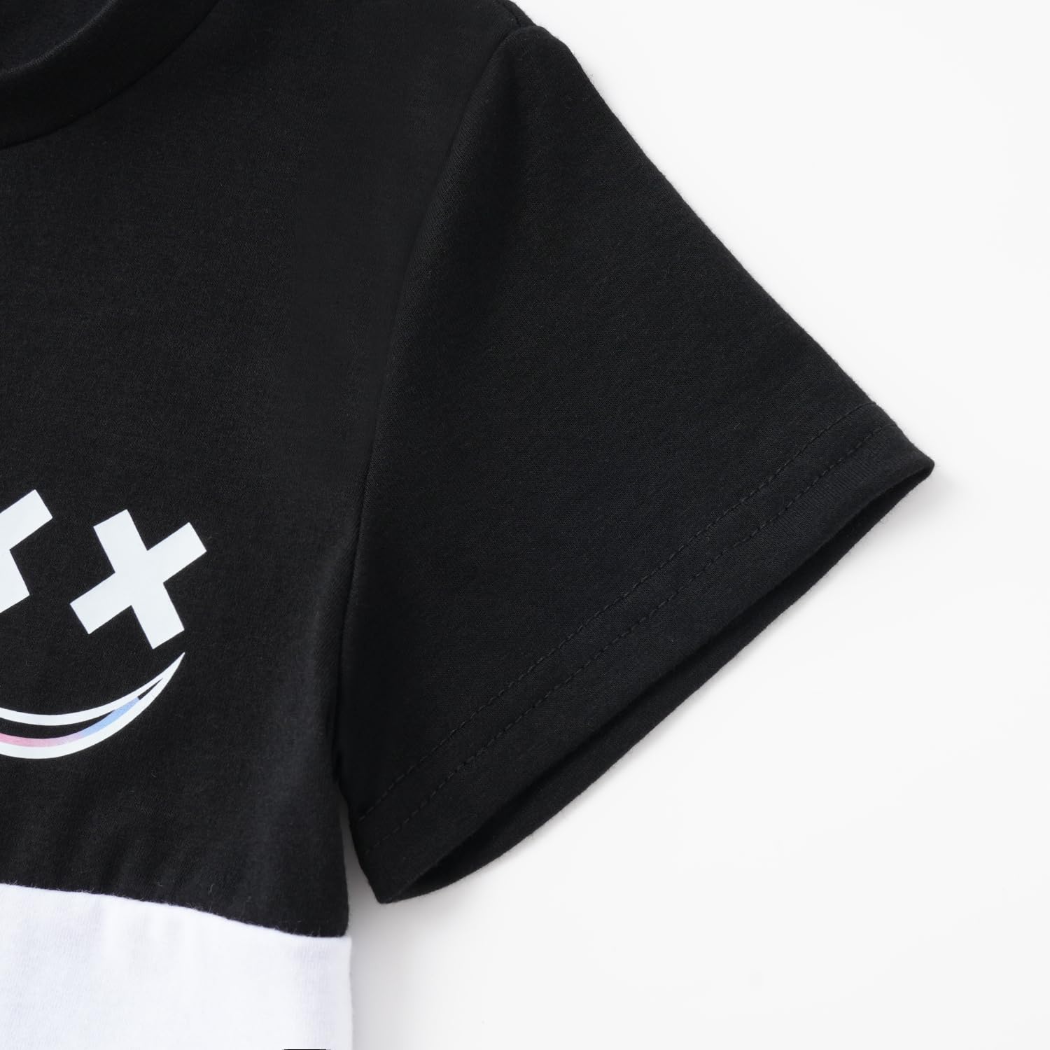 Black t-shirt with a white logo on a white background