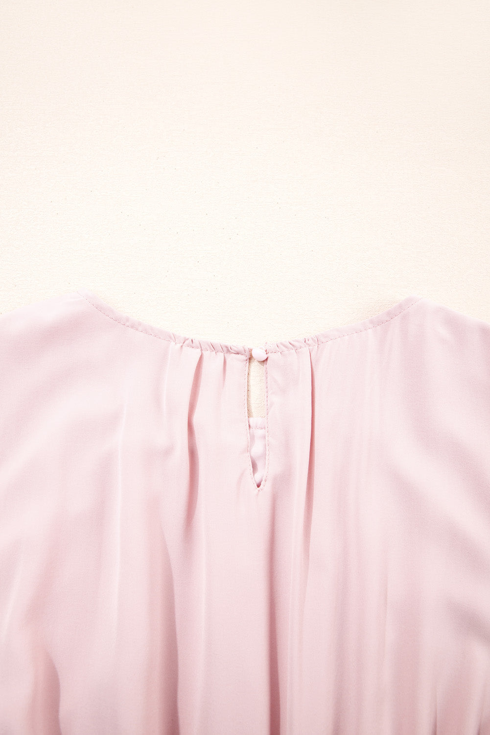 Close-up of a light pink fabric texture