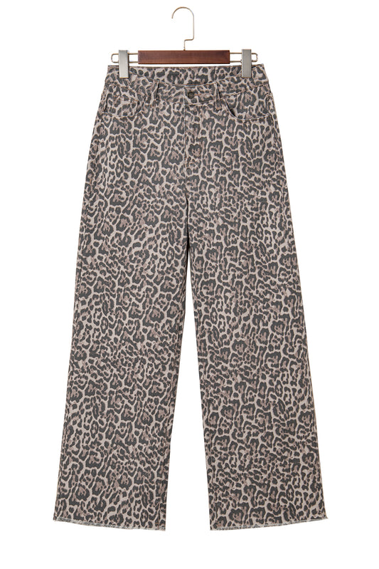 Leopard print pants on a hanger against a white background