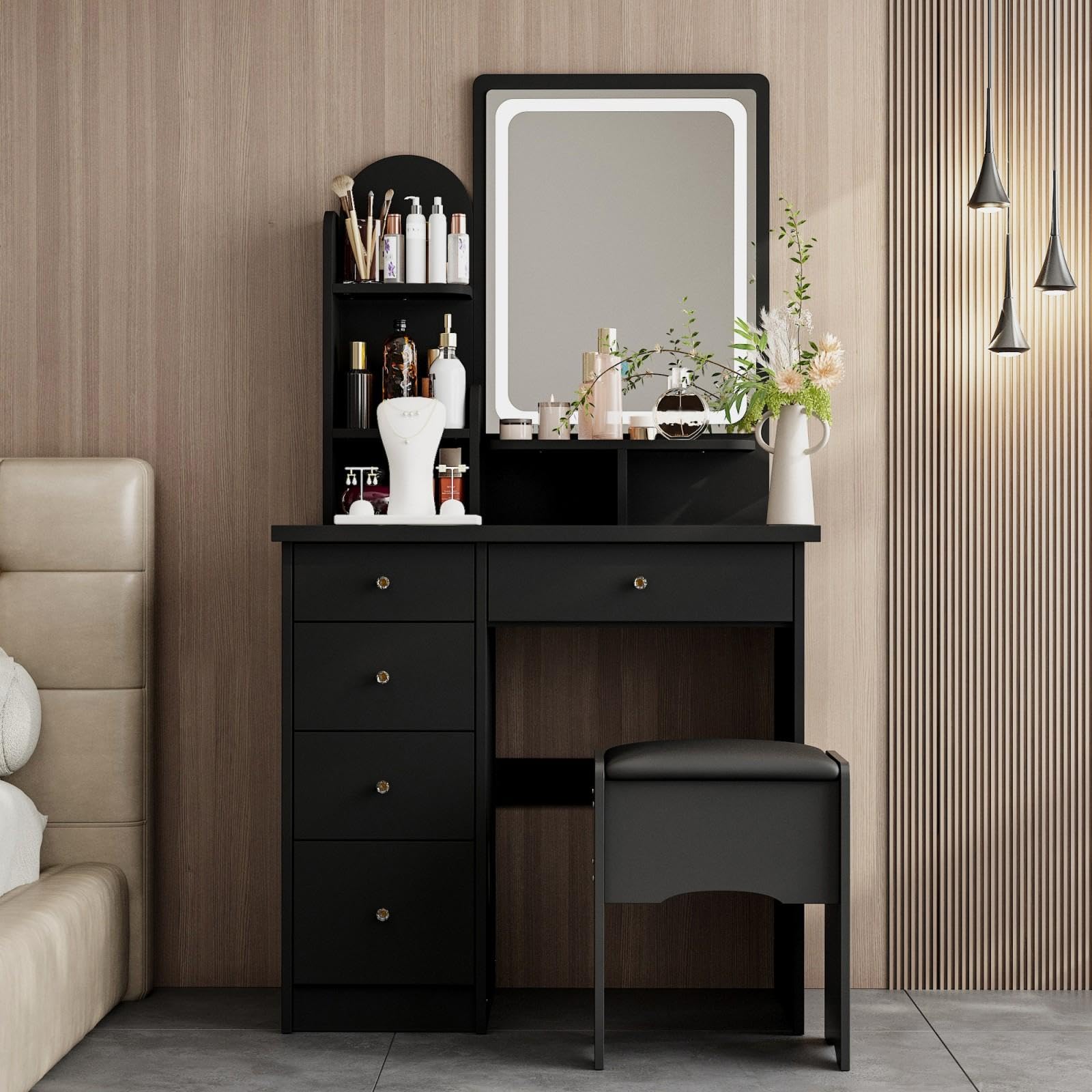 Black vanity table with mirror and stool in a bedroom setting