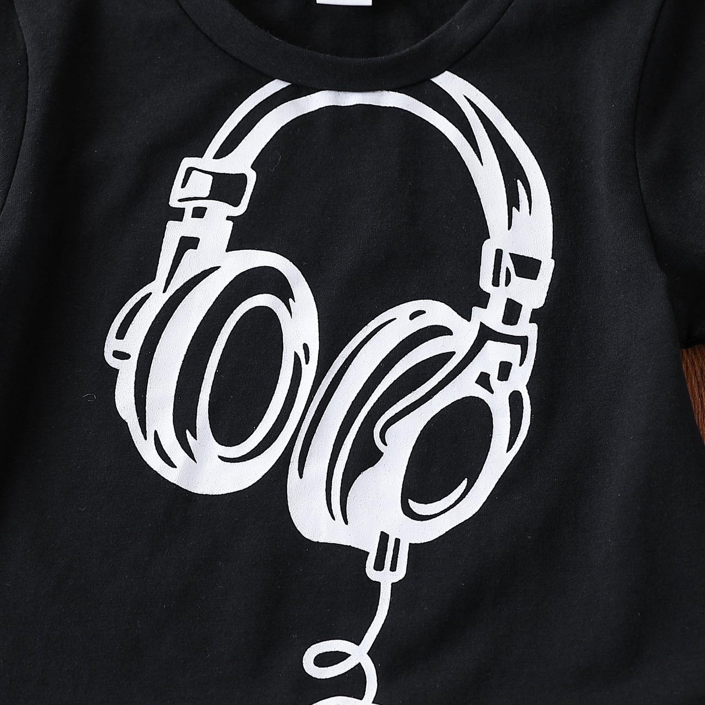 Black t-shirt with white headphones graphic design