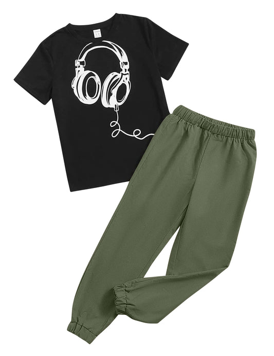 Black t-shirt with headphones graphic and green pants on a white background