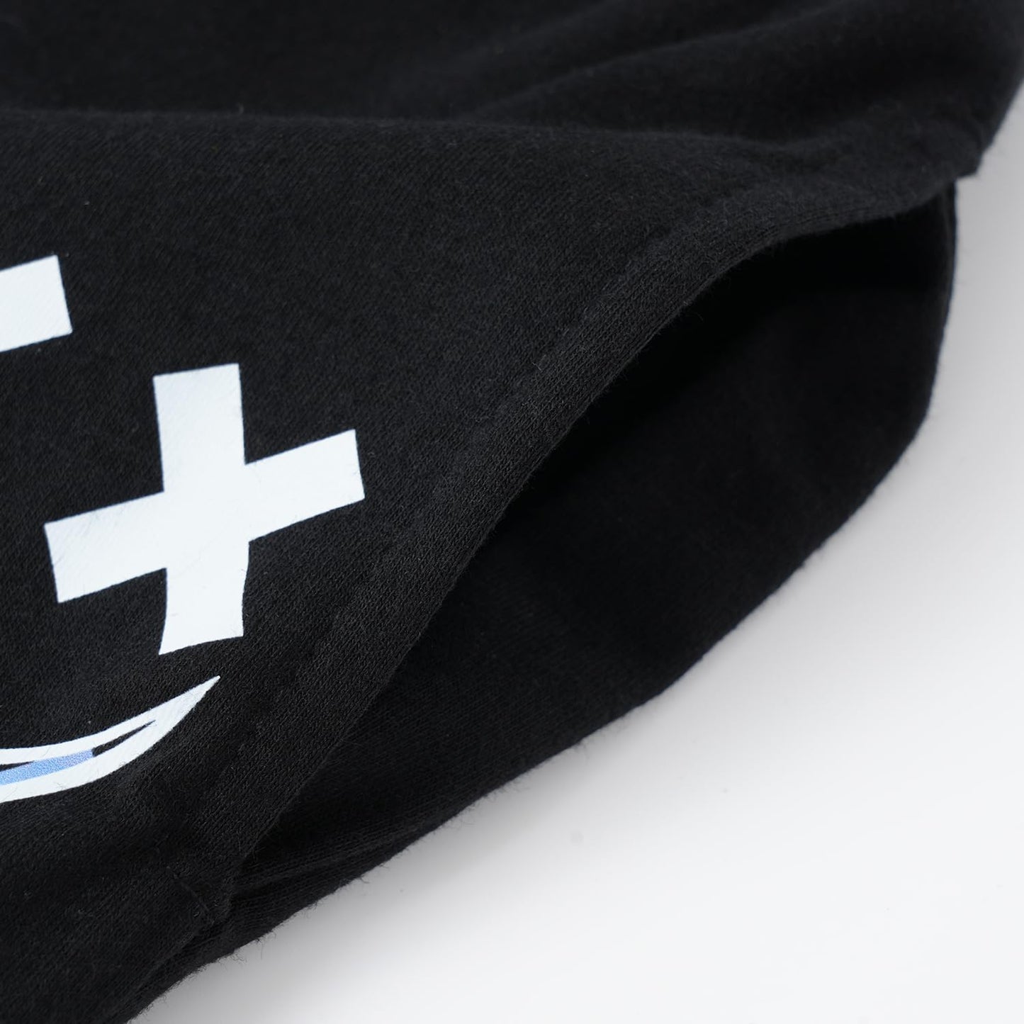 Black hoodie with a white logo on a light gray background