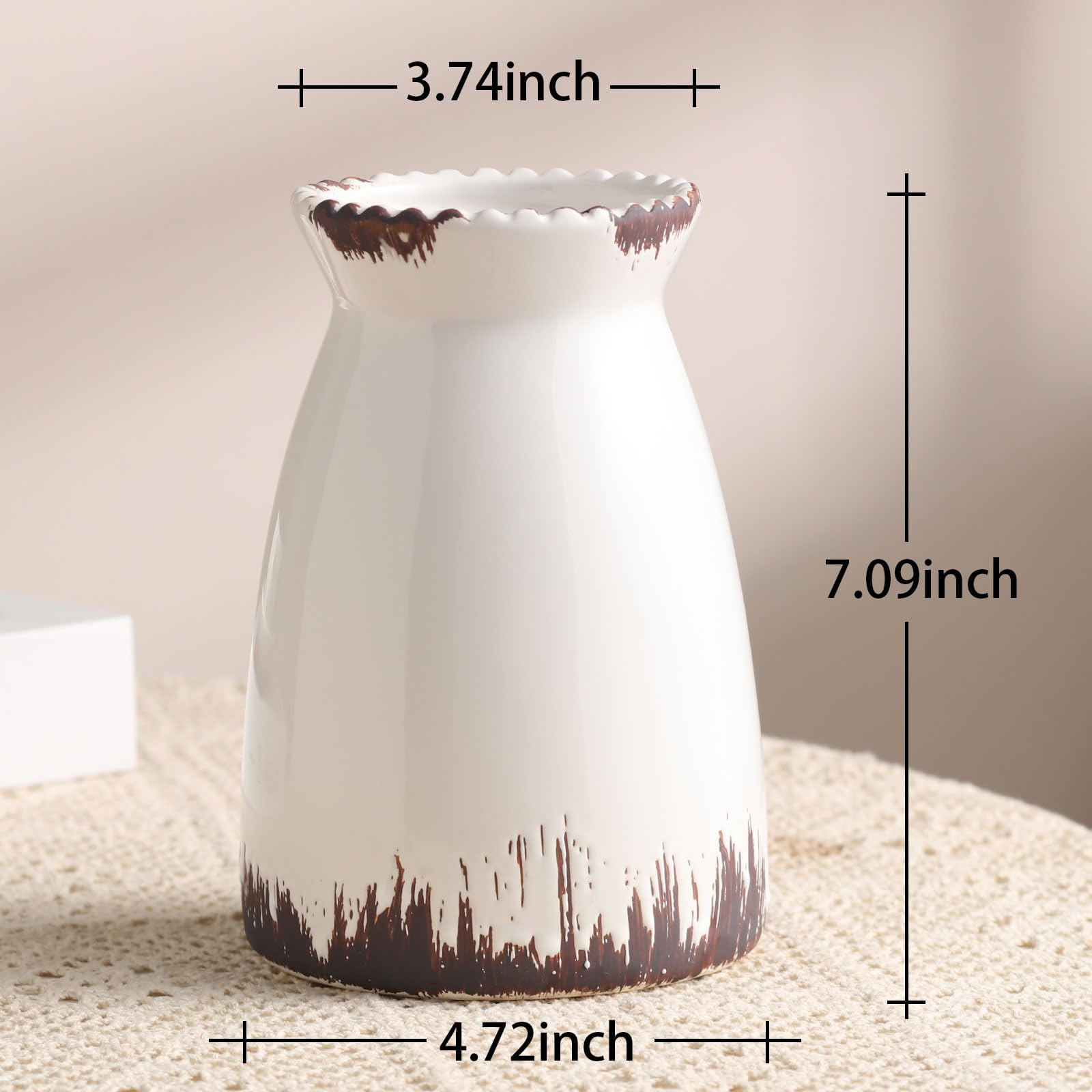 White ceramic vase with brown accents and measurements on a neutral background