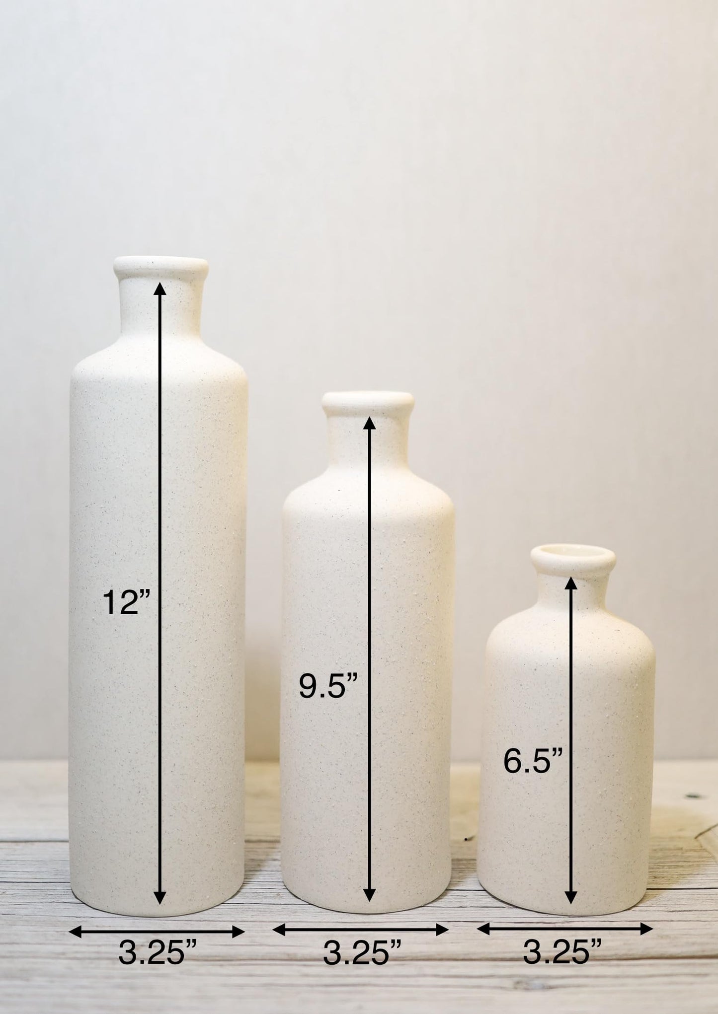 Three white vases of different sizes with measurements on a white background