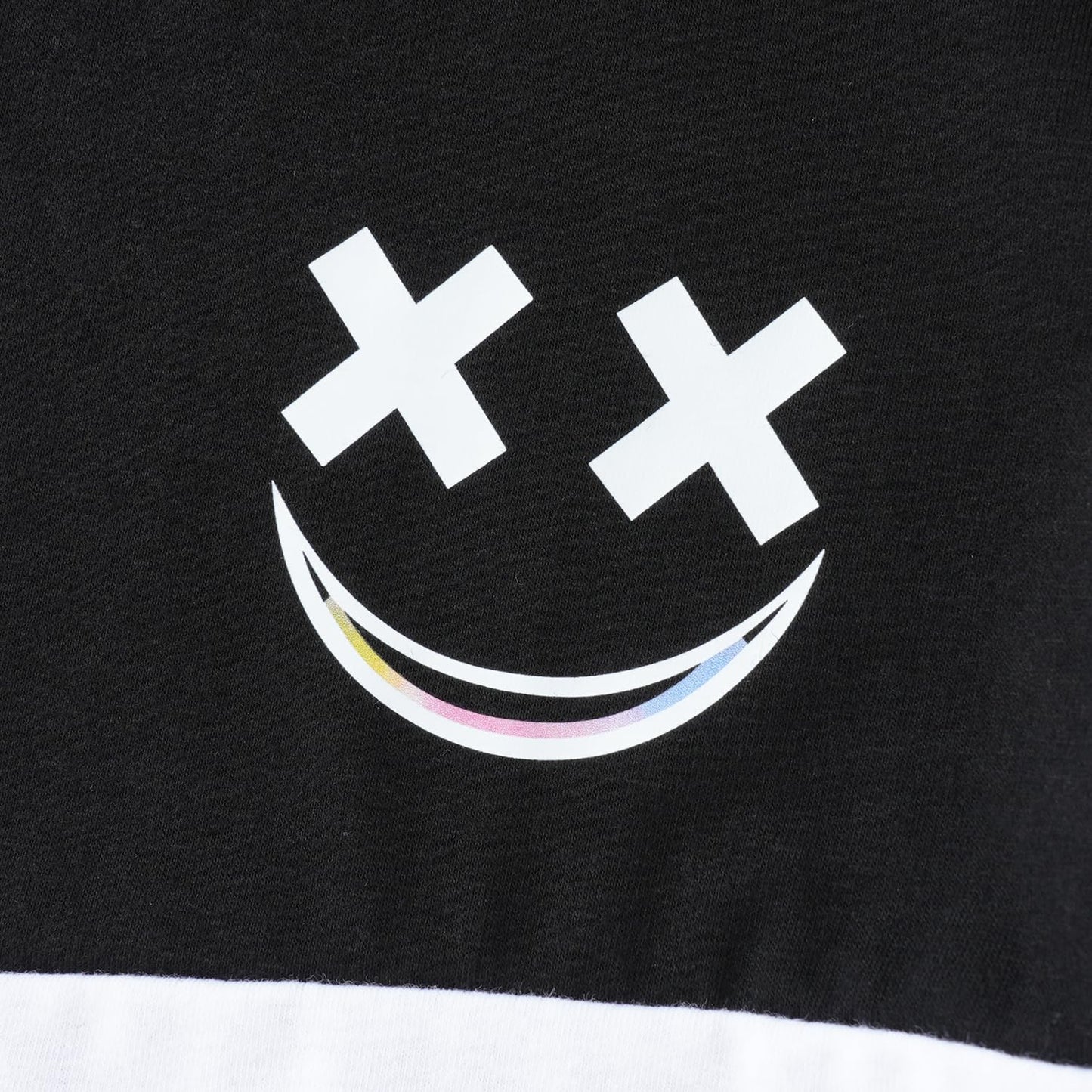 Black t-shirt with a white smiley face design featuring colorful dots on a black background