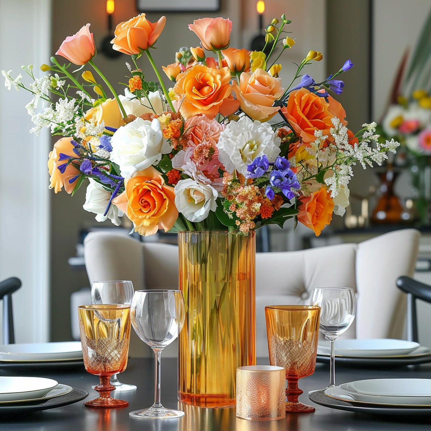 Colorful flower arrangement in a vase on a dining table with glasses and plates.