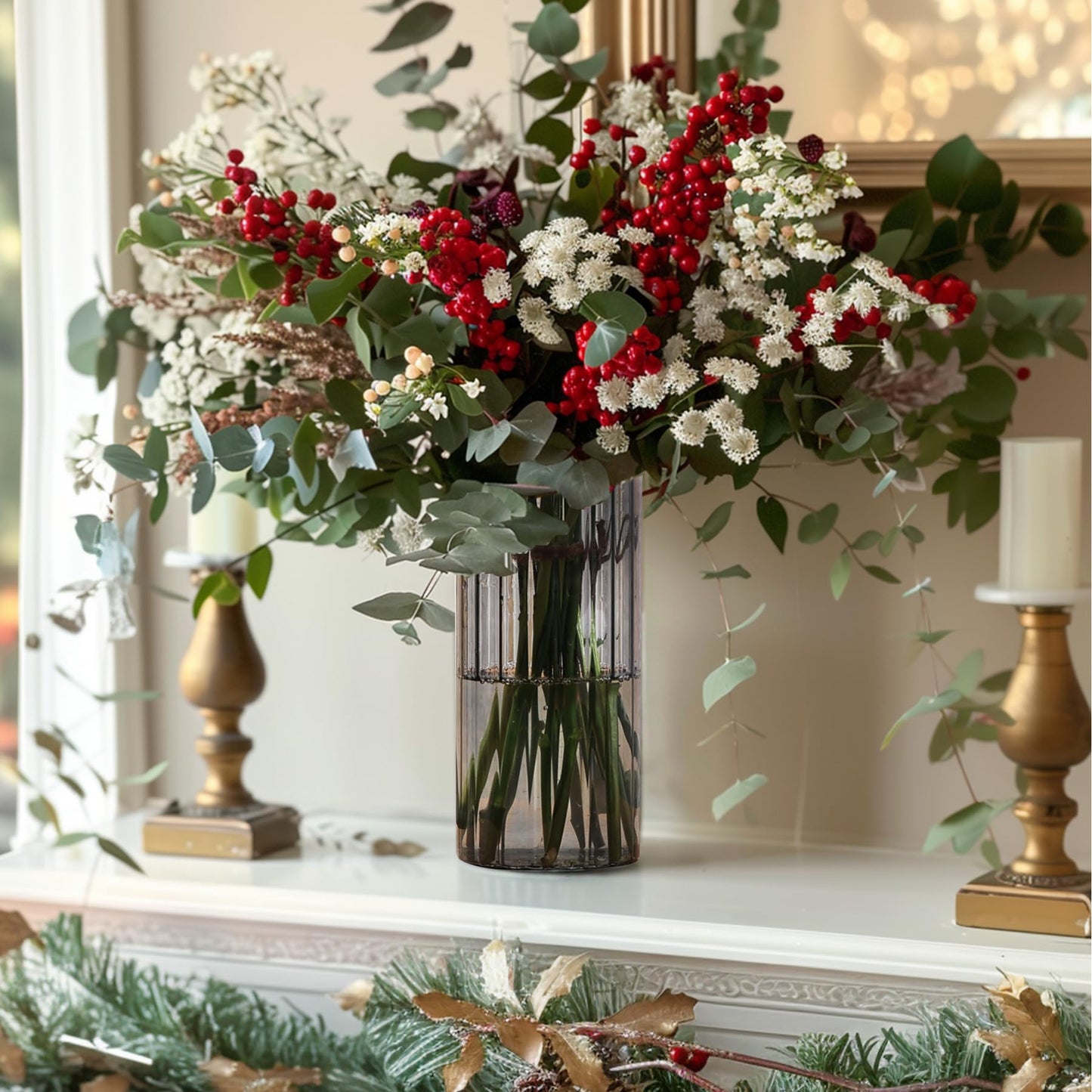 Decorative floral arrangement with red berries and greenery in a vase on a mantelpiece.