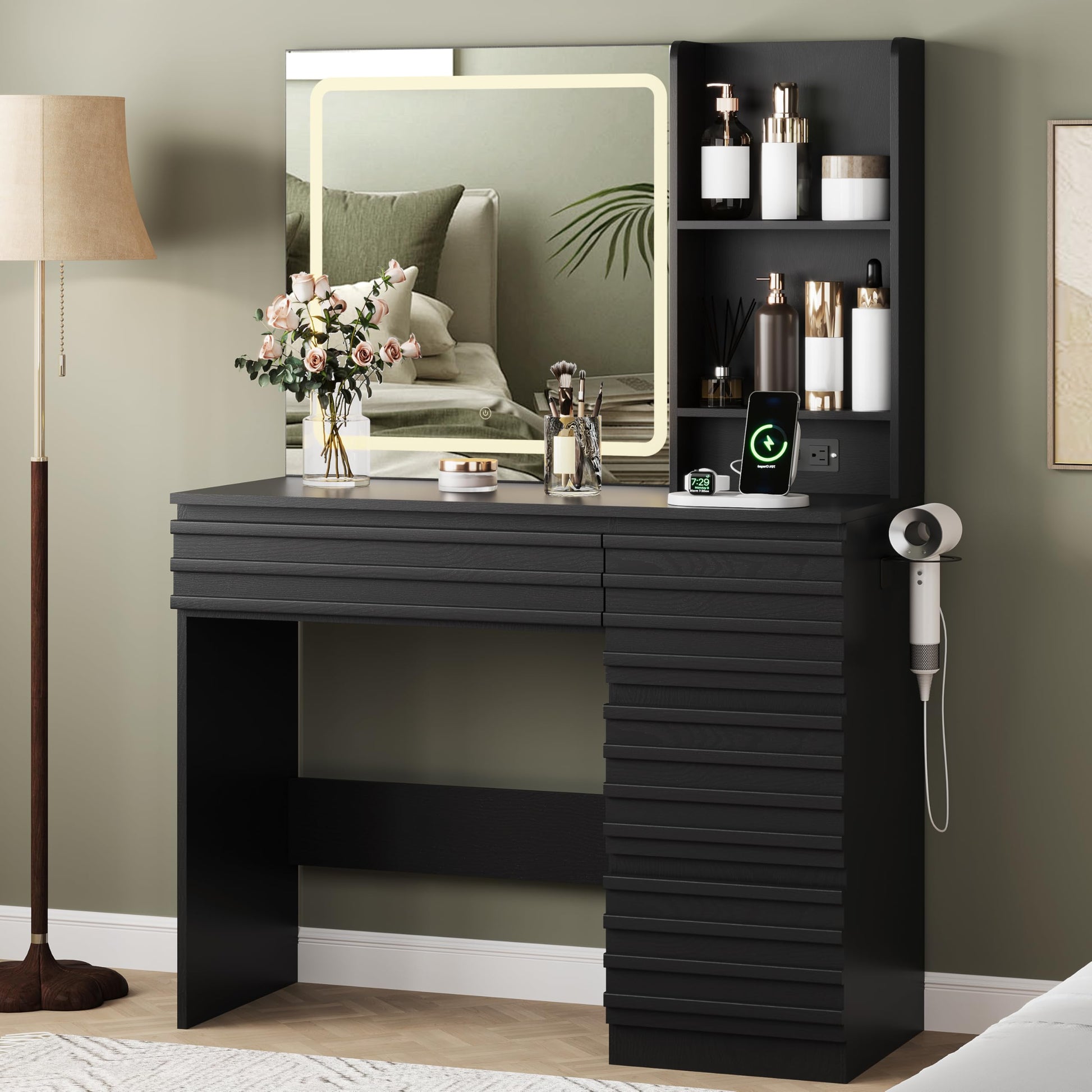 Black vanity table with mirror, lights, and various items in a room setting.