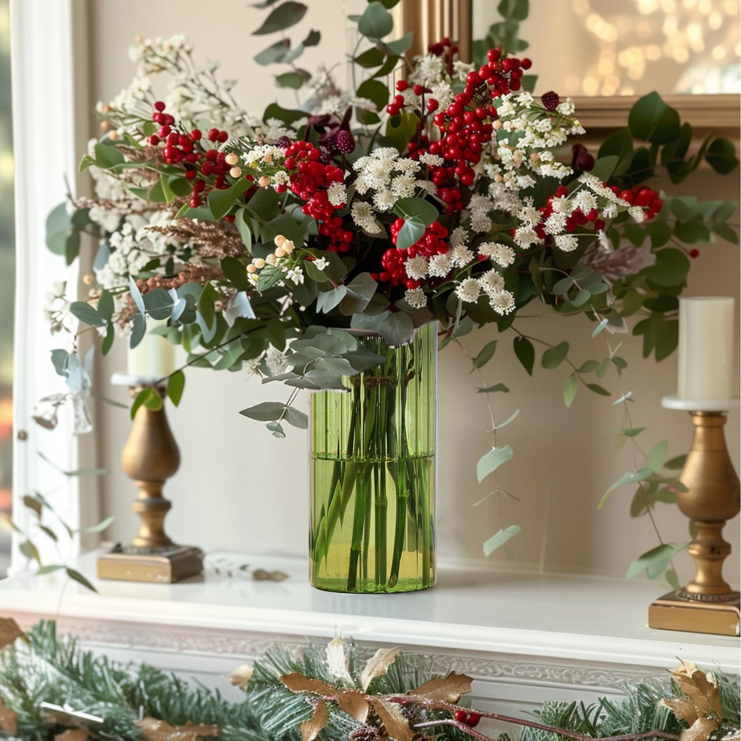 Decorative arrangement with red berries, green leaves, and a vase on a surface.