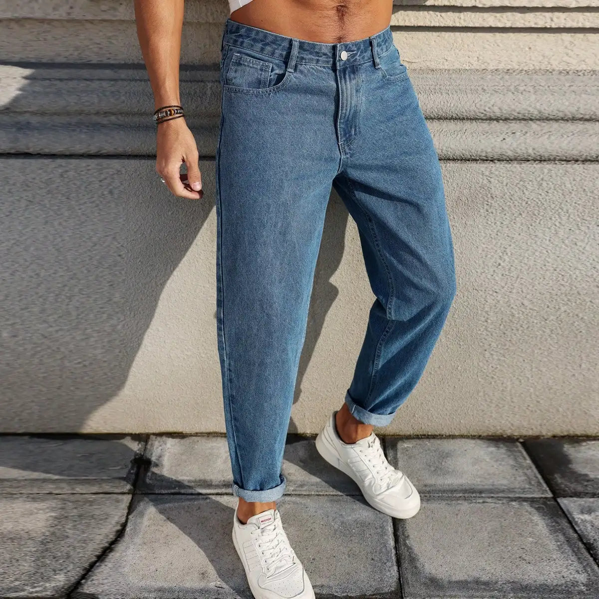 Men's jeans are made of classic blue denim fabric with a loose fit