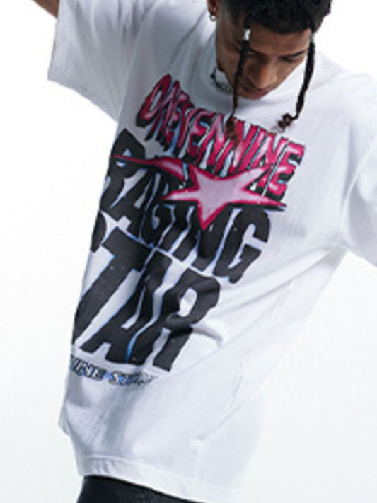 Person wearing a white t-shirt with black and red text and graphics