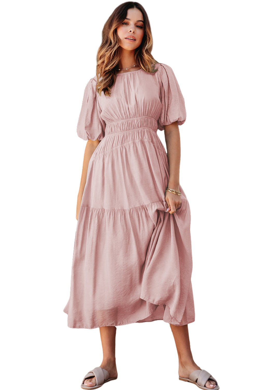 Woman wearing a pink dress on a white background